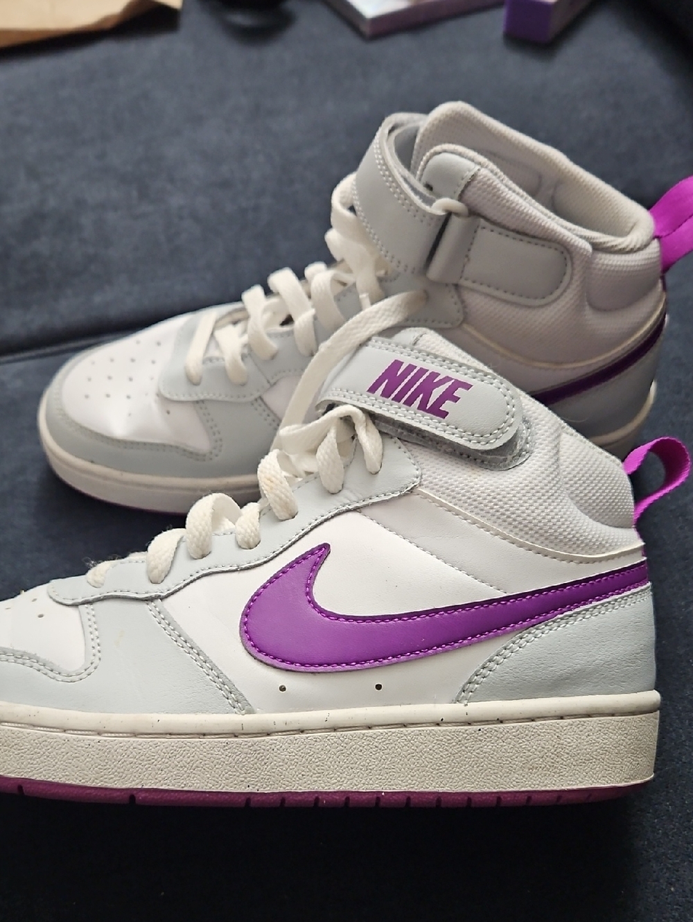 Nike White High-Top Sneakers with Purple Swoosh